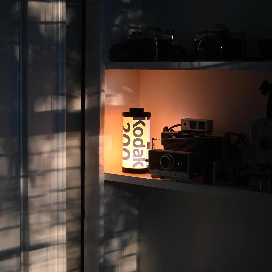 Vintage Film Canister Table Lamp with Warm Golden Glow